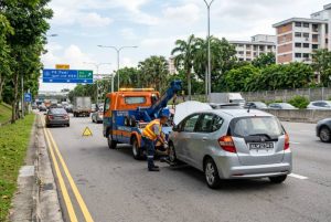 Towing service near me Singapore helping a car on the roadside
